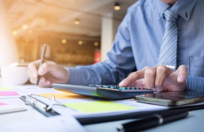 business-finance-man-calculating-budget-numbers-invoices-financial-adviser-working_1423-119